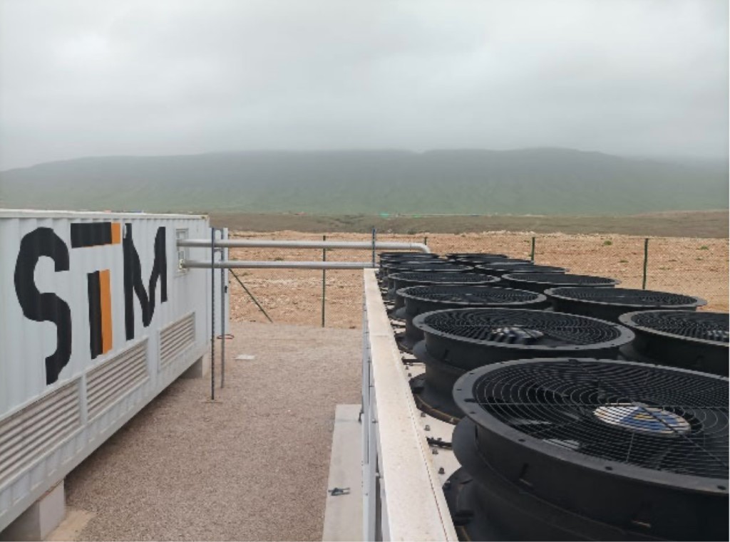STM mining container with external cooling fans and site landscape